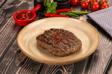 Grilled beef burger cutlet with sauce