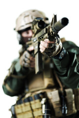 Close-up View of a Tactical Soldier Aiming Rifle in Military Gear
