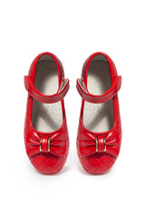 Red leather girls' ballerinas with bow on white background
