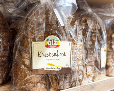 Freshly packaged krustenbrot loaves on a bakery shelf