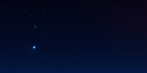 Serene night sky with sparkling stars and deep blue horizon