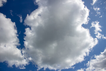 Blue sky with white clouds. The background is a clear blue sky without any cumulus clouds.