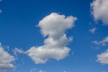 Blue sky with white clouds. The background is a clear blue sky without any cumulus clouds.