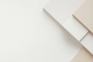 A simple composition of overlapping geometric shapes in muted tones, creating a clean and modern design