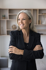 Professional businesslady, company boss or founder portrait. Middle-aged businesswoman standing in...
