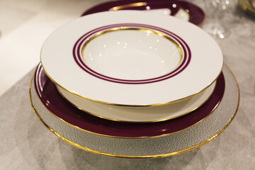 beautiful table setting, empty beautiful ceramic plates on the table