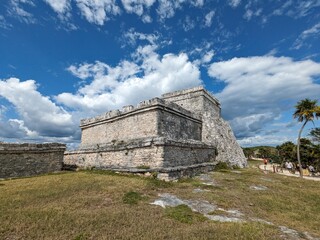 Ancient Tulum ruins temples and houses on Caribbean coast in Mexico, documenting Mayan archaeological site, stone structures on seaside cliff, and cultural heritage within tropical coastal landscape