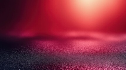 A close-up view of a glossy, textured red surface with subtle gradients and a soft glow effect, creating an atmospheric and luxurious feel.