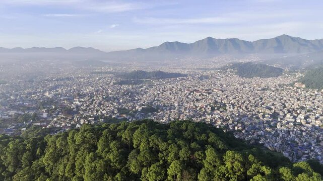 Kathmandu, Nepal city aerial view over hill looking down into valley (4K HDR drone footage)