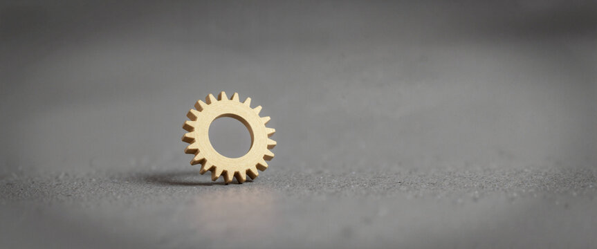 Efficiency optimization gear in a minimalistic setting representing industrial design with muted tones and soft shadows