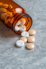 Amber Pill Bottle and Spilled Tablets