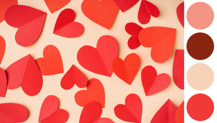Red paper hearts on yellow background. Valentine's Day celebration