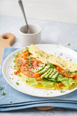 Tasty omelet with vegetables on color grunge background