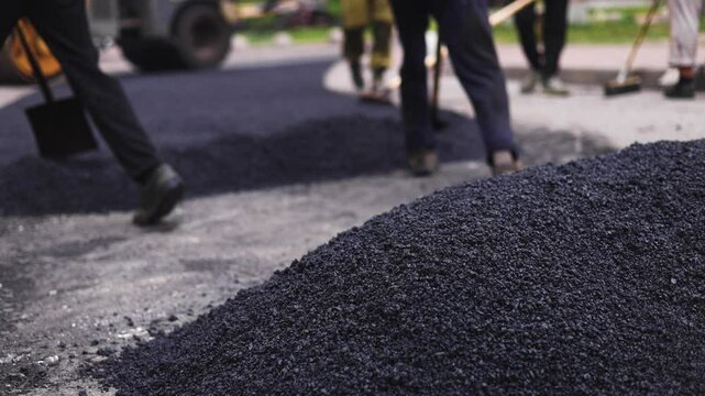 Roadworks, process of asphalting, blacktopping and paving new road layer, laying new asphalt road pavement, paver machine and steam roller compactor, city street construction site, vehicle working
