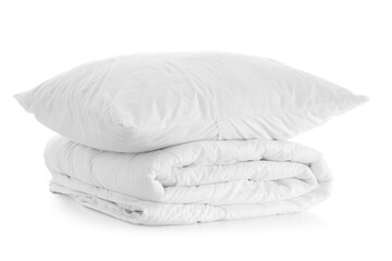 Folded blanket and pillow isolated on white background