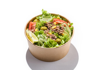 salad with tuna, tomatoes, cucumber and olives in container