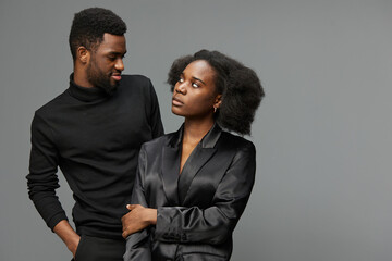 Stylish African couple in elegant attire with confident emotions, perfect for love and relationship concepts