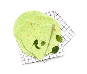 Obraz premium Checkered napkin with round green lavash and spinach on white background