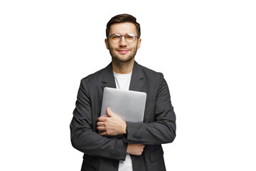 Business professional holds a laptop with a confident smile in a studio setting