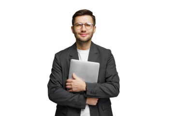 Business professional holds a laptop with a confident smile in a studio setting
