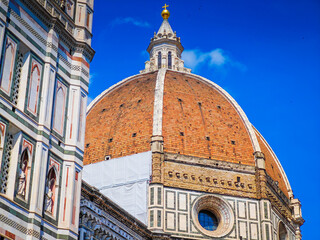 Fototapeta premium Cathedral of Santa Maria del Fiore. Fragments and elements of Florence Duomo basilica facade. Close up dome photo