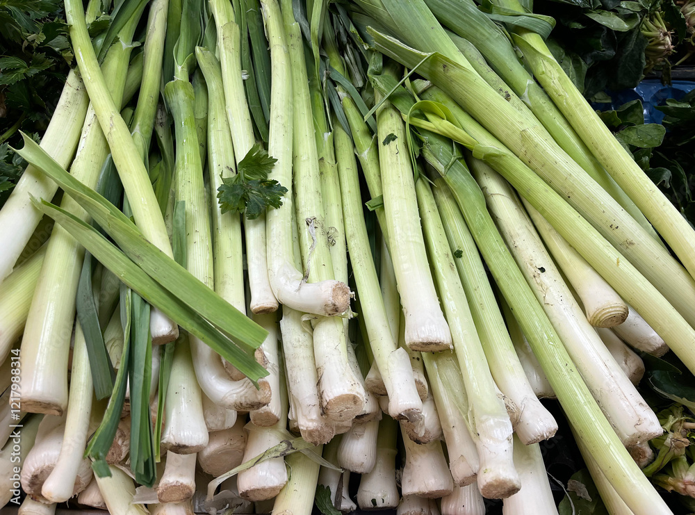 Wall mural  Raw leeks on a supermarket counter.