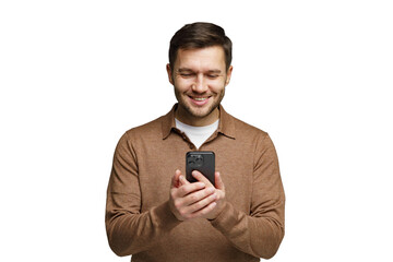 Man smiling while using smartphone indoors during daytime in casual clothing