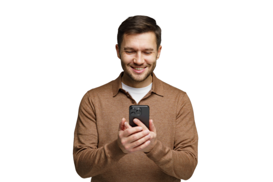 Man smiling while using smartphone indoors during daytime in casual clothing