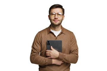 Man holding a tablet and smiling while dressed in a brown sweater, posing against a plain background