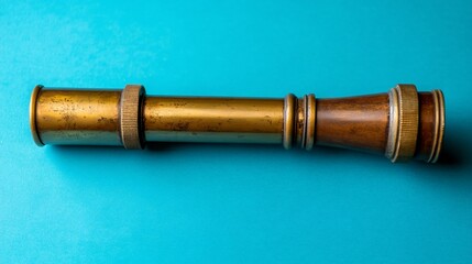 Vintage Brass and Wood Telescope on Blue Background