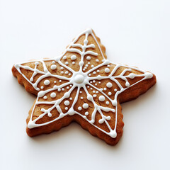 Star-shaped gingerbread cookie with intricate white icing design. Festive holiday treat, perfect for Christmas baking.