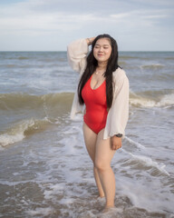 Woman young asian fat chubby cute beautiful smile happy fun enjoy relax freedom bikini swimwear body sexy plus size look sea beach sunset clean blue sky calm nature ocean wave water travel on holiday
