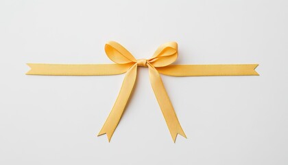 Fototapeta premium A vibrant yellow ribbon tied in a bow, elegantly displayed on a clean white background