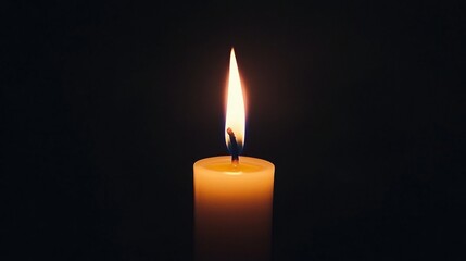 Close-up of a candle flame against a dark background, with the flames warm glow creating a dramatic contrast and a calming effect.