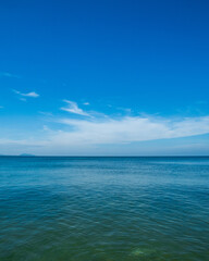 Obraz premium Landscape beautiful summer vertical horizon look view point shore open sea beach cloud clean and blue sky background calm nature ocean wave water nobody travel at thailand chonburi sun day time