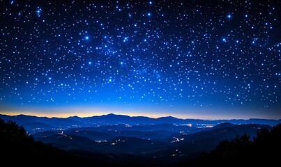 Vast night sky filled with twinkling stars above a mountain range with city lights.  Dark silhouettes of mountains.  Mystical and beautiful celestial view.