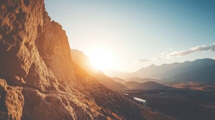 Naklejka premium Sunset over majestic mountains and valley.