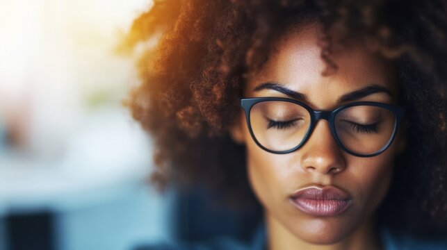 A tired businesswoman with glasses sleeps at her desk, showing exhaustion after a demanding day at work - Powered by Adobe