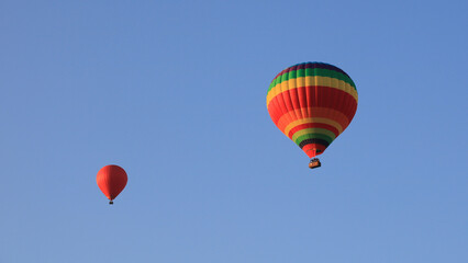 Two colorful balloons over Vang Vieng, Laos.