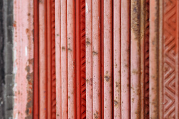 red metal siding, garage door or roofing, vertical striped