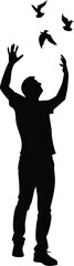 Silhouette of a man with birds flying