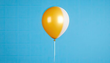 Bright yellow and white balloon floating against a vibrant blue background, evoking a festive mood