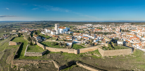 Aerial view of the castle of Estremoz in Portugal dominated by a square keep built from white marble, surrounded by four gates, bastions, ravelins and other defensive structures © tamas