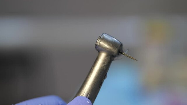 High-speed dental bur, which is fitted with a diamond bur for interproximal tooth grinding. Recorded at a low speed so that the water jet can be clearly seen.