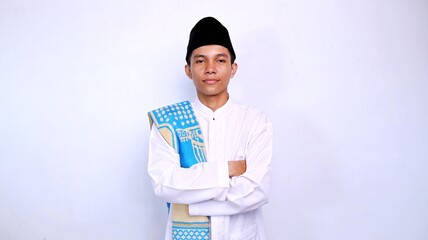 handsome young asian muslim smiling expression crossed hands gesture isolated white background
