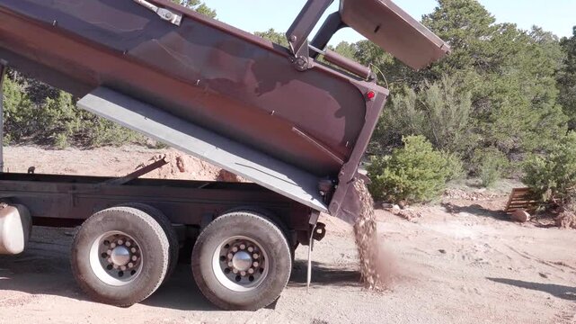 Dump Truck Dumping Bark Load