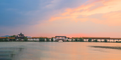 An ancient building complex and sunset scenery on the Taihu Lake Lake in Wuxi, Jiangsu Province, China will be on June 3, 2024