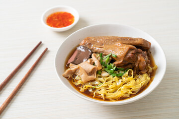egg noodles with stewed and braised duck in brown soup