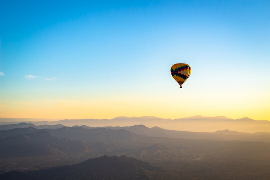 Colorful pattern hot air balloon in the skies over the Phoenix Arizona Sonoran Desert. Photo taken on a clear day