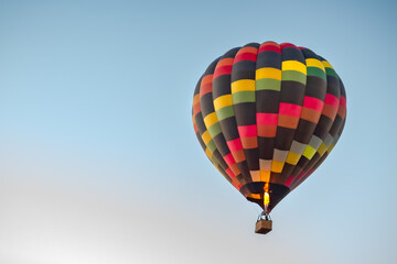 Colorful pattern hot air balloon in the skies over the Phoenix Arizona Sonoran Desert. Photo taken on a clear day